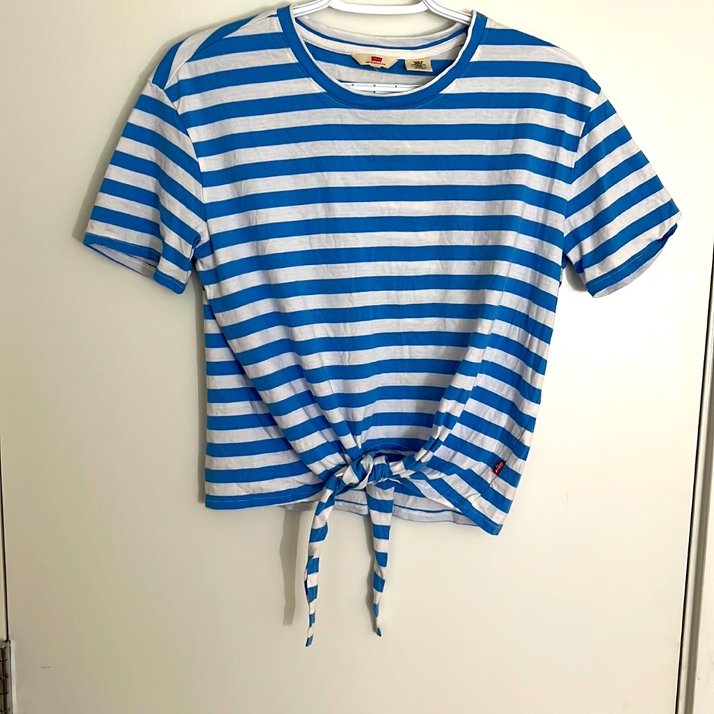 A white top with Blue stripes